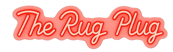 Neon sign with 'The Rug Plug' text on a white background